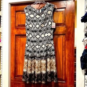 Gabby Skye, brand new size 10 dress. Super cute and very slimming.